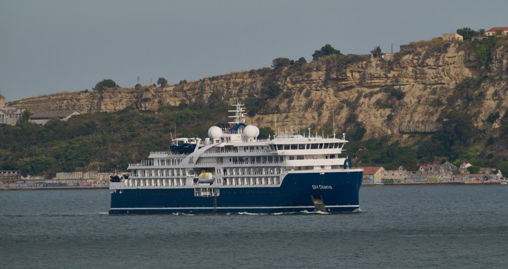 SH Diana, a luxury expedition cruise ship that is the largest in the Swan Hellenic fleet offering accommodation for up to 192 guests, sails the Tagus River after leaving the city's cruise terminal on August 17, 2023 in Lisbon, Portugal.