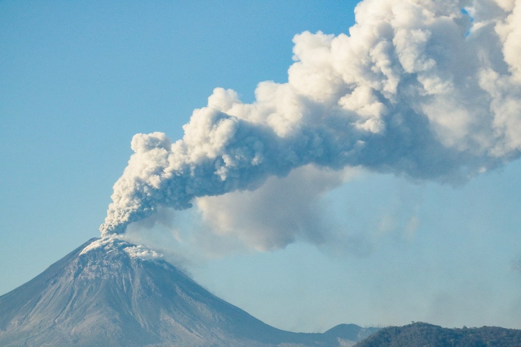 Mount Lewotobi Laki Laki erupting, spewing ash and smoke, as seen from Lewolaga village in Titihena, East Nusa Tenggara, on November 13, 2024